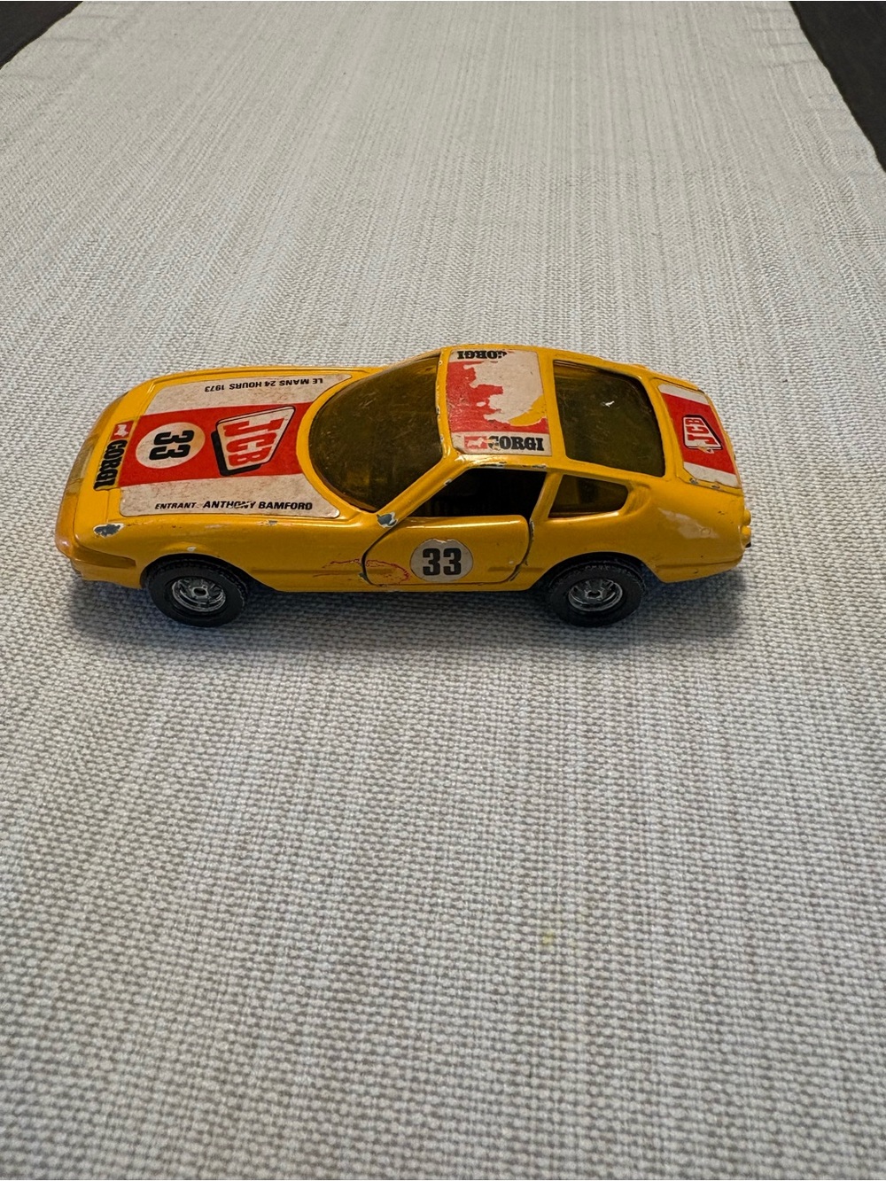 Yellow Die-Cast Racing Car Toy with Number 33 Corgi Ferrari vintage